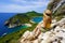 Travel in Greece. Female hiker girl enjoying natural landscape in Corfu Island, Greece