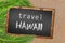 Travel Hawaii palm trees and blackboard on sandy beach