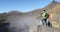 Travel Hiker Taking Landscape Picture On Active Volcano Mountain With DSLR