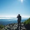 Travel hiker taking photo of majestic mountains range panorama. Carpathian mountains, Ukraine, Europe. Travel background,