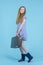 Travel Ideas. Full Length Portrait of Caucasian Teenage Girl In Long Blue Dress, Wellington Rubber Boots Posing With Travel