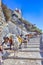 Travel Ideas. Line of Mules Resting In Stalls and Waiting for Tourists in Thira Fira the Capital of Santorini island