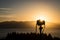 Travel image of a camera set up to shoot sunset on top of a hill in New Zealand