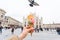 Travel, Italy, gelato and holidays concept - Ice cream in front of Milan Cathedral Duomo