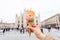 Travel, Italy, gelato and holidays concept - Ice cream in front of Milan Cathedral Duomo