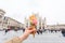 Travel, Italy, gelato and holidays concept - Ice cream in front of Milan Cathedral Duomo