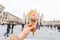 Travel, Italy, gelato and holidays concept - Ice cream in front of Milan Cathedral Duomo