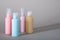 Travel kit. Set of four small plastic bottles for cosmetic products.