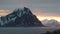 Travel landscape. Nature of Norway. The snowy mountains of the Lofoten Islands. Snow covered mountain range on coastline