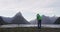 Travel landscape nature photographer tourist taking photo of Milford Sound and Mitre Peak in Fiordland National Park