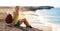 Travel in Lanzarote. Young backpacker woman sitting on rocks looks at you with Playas Papagayo beaches and Atlantic Ocean on the