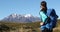 Travel lifestyle - active woman hiker backpacking on hike looking at mountain