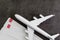 Travel lover special prize or honeymoon trip concept, toy airplane with 2 blank boarding pass on black texture dark black cement