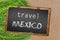 Travel Mexico palm trees and blackboard on sandy beach