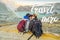 TRAVEL MORE concept Young tourist man and woman sit at the edge of the crater of the Ijen volcano or Kawah Ijen on the