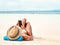 Travel, phone and woman relaxing on the beach scrolling on social media or mobile app on holiday. Rest, tropical and