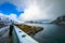 Travel photographer doing pictures outdoor at evening time. Lofoten islands. Beautiful Norway landscape