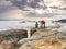 Travel photographer man taking nature video of mountain lookout.