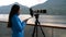 Travel photographer with professional telephoto lens camera in Alaska