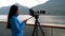 Travel photographer with professional telephoto lens camera in Alaska