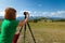 Travel photographer taking nature photo