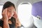 Travel plane sick woman fear of flying headache