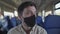 Travel safely covid 19 on public transport. Train passenger with protective mask travels sitting on seat with social