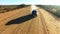Travel, sand and desert with truck in dirt road of Namibia countryside for freedom, transportation or journey. Adventure