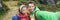 Travel selfie couple hikers taking smartphone picture on outdoor trail hike in outdoor nature. Active healthy happy