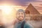 Travel Selfie photo man in hat background pyramid of Egyptian Giza and Sphinx, sunset Cairo, Egyp