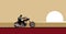 Travel to faraway. Freedom rider. A lone biker moves through the desert.