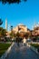 Travel to Istanbul vertical background photo. Tourists and Hagia Sophia