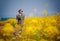 Travel to Jeju Island, South Korea, a young girl tourist walks on the background of blooming fields