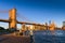 Travel to New York. The skyline of Manhattan photographed during a summer sunrise, view to Brooklyn Bridge.