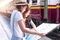 Travel together of two young woman looking map in train station. Young women expressing positivity using generic map