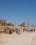 Travel tour group wanders through Karnak Temple. Egyptian landmark with hieroglyphics, decayed