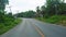 Travel and tourism on the asphalted highway by car or motorbike. forest along the road