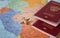 Travel and tourism concept with passport travel documents, airplane on world map background.