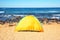 travel, tourism, hike concept - view sea camping tent on beach