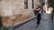Travel tourist girl laughing twirling happy in old city of Europe