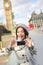 Travel tourist in london taking selfie photo