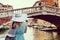 Travel tourist woman with backpack in Venice, Italy. girl on vacation smiling happy by Grand Canal. girl having fun traveling