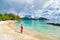Travel tourist woman at French Polynesia beach on Huahine island cruise excursion on Tahiti holiday vacaton. Girl