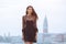 Travel tourist woman on pier against beautiful view on venetian chanal in Venice, Italy.