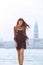 Travel tourist woman on pier against beautiful view on venetian chanal in Venice, Italy.