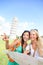 Travel tourists friends holding map in Pisa, Italy