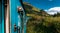 Travel by train, panorama. Road trip. Blue Sri Lankan Train goes through jungles, trees, wood, mountains. Famous blue train