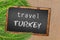 Travel Turkey palm trees and blackboard on sandy beach