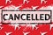 Travel, vacation ban, refund concept. Pattern of white airplanes with text cancelled on red background. Top view. Flight