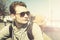 Travel or Vacation Concept. Closeup traveler looking ahead. Travel retro concept. View in front of mans face on sea background. T